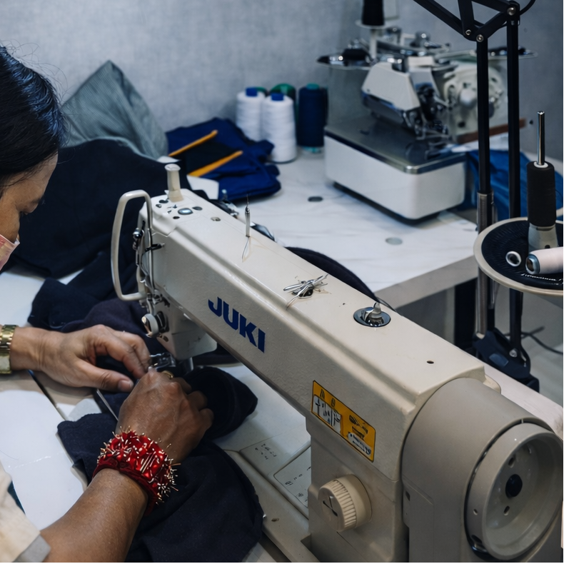 Tailor at a sewing machine at Prive Atelier, JLT