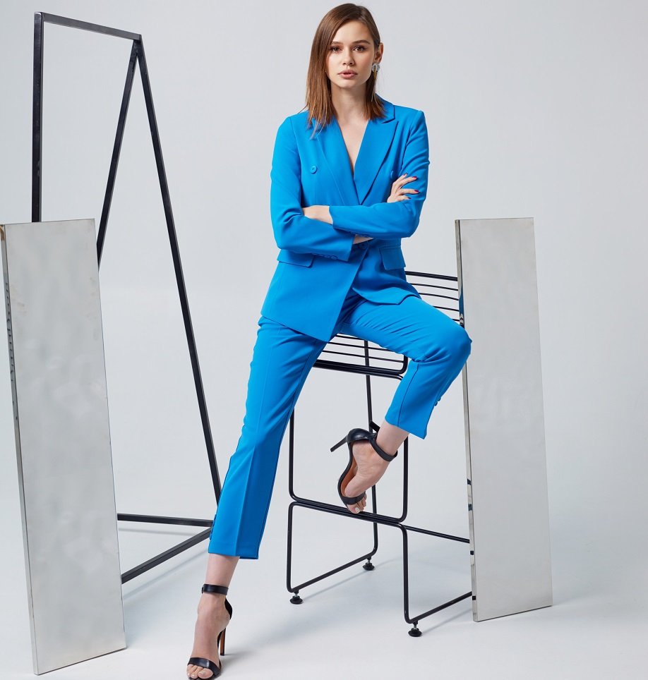 Woman wearing a blue tailored suit by House of Tailors